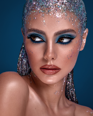 a beautiful wooman person with glitter on her face wow